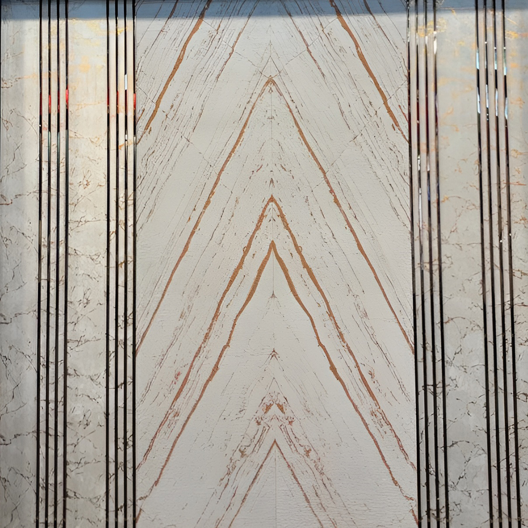 Premium fabric-backed stainless steel wall panel with bold chevron design, natural stone veining and elegant vertical metal lines