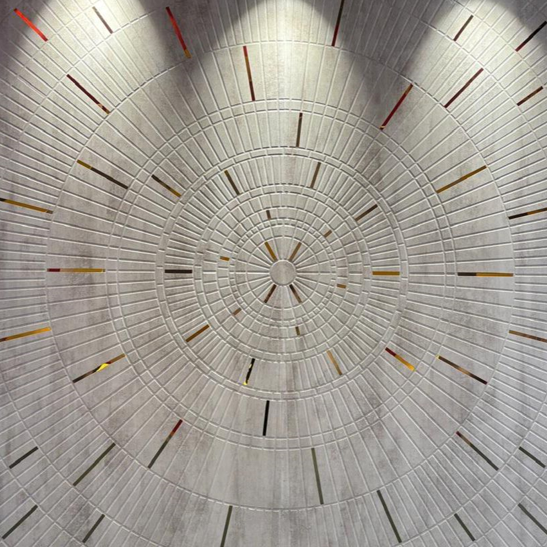 Premium fabric-backed stainless steel wall panel with mesmerizing concentric circle design and delicate gold accents