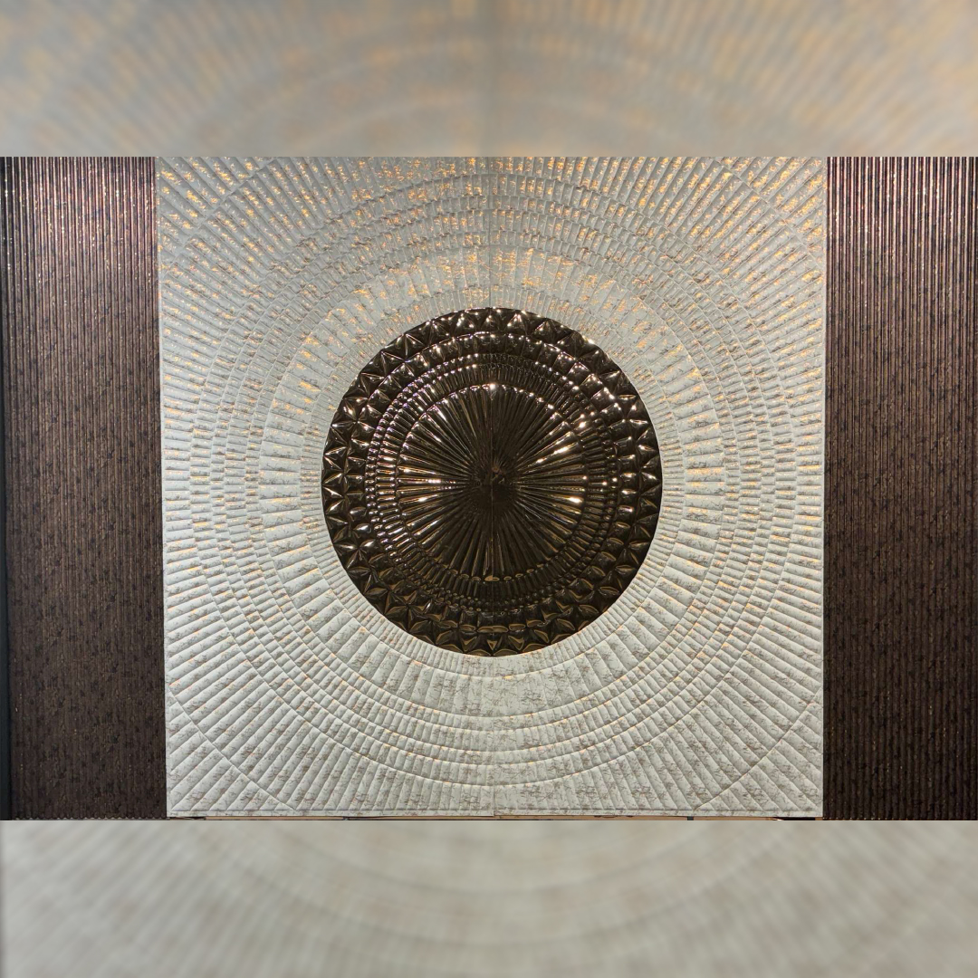 Premium fabric-backed stainless steel wall panel with striking fusion of concentric textured circles and rich metallic accents
