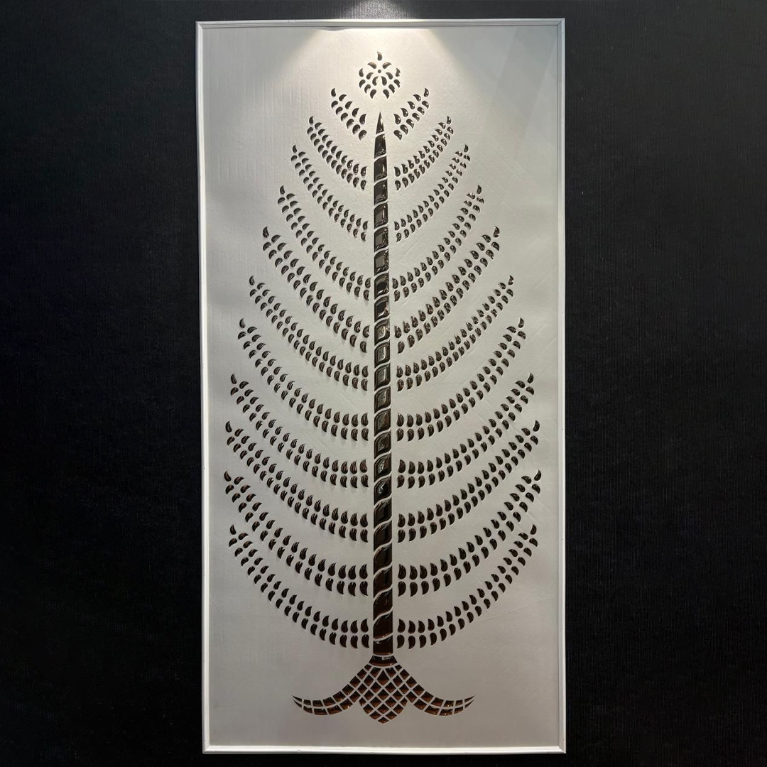 Premium fabric-backed stainless steel wall panel with intricate laser-cut leaf design and reflective metallic finish