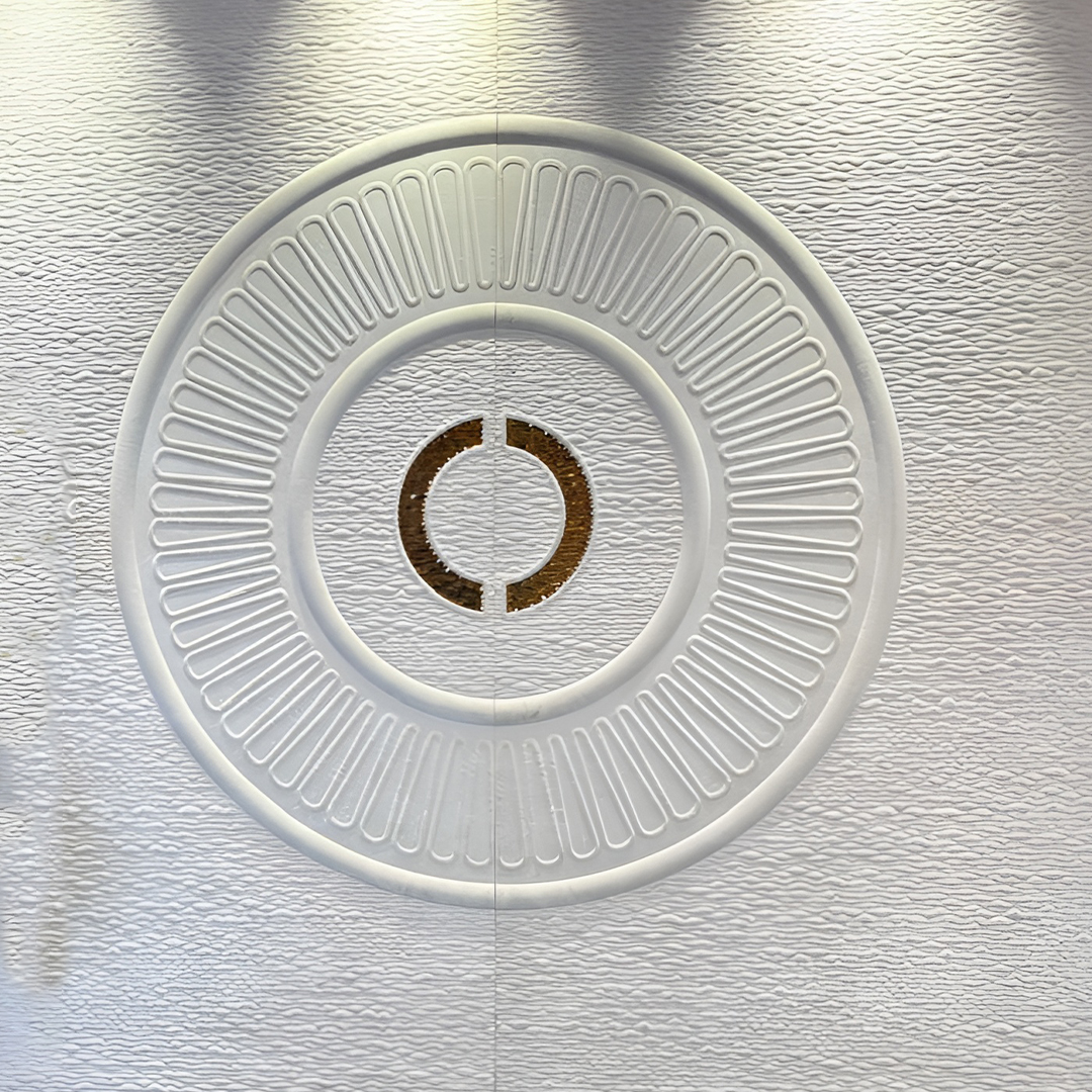 Premium fabric-backed stainless steel wall panel with clean minimalist circular design and textured concentric rings
