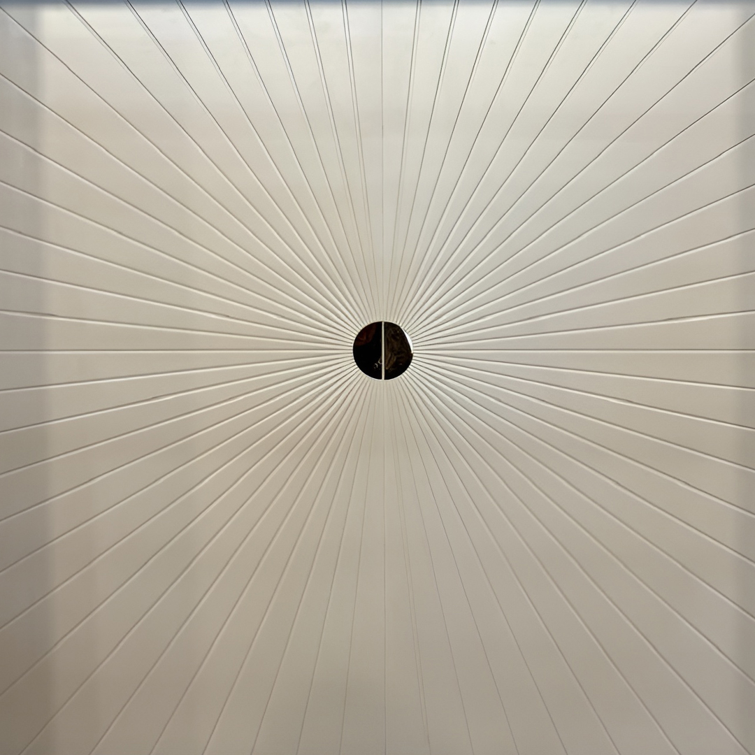 Premium fabric-backed stainless steel wall panel with striking sunburst design and radial lines